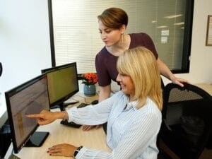 The distribution manager and Senior Client Coordinator reviewing a distribution route