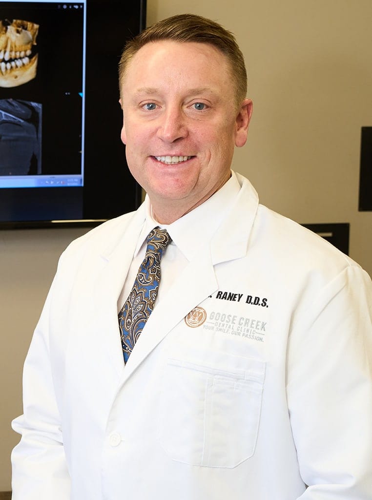 Portrait of Dr. Rick Raney in front of an x-ray display