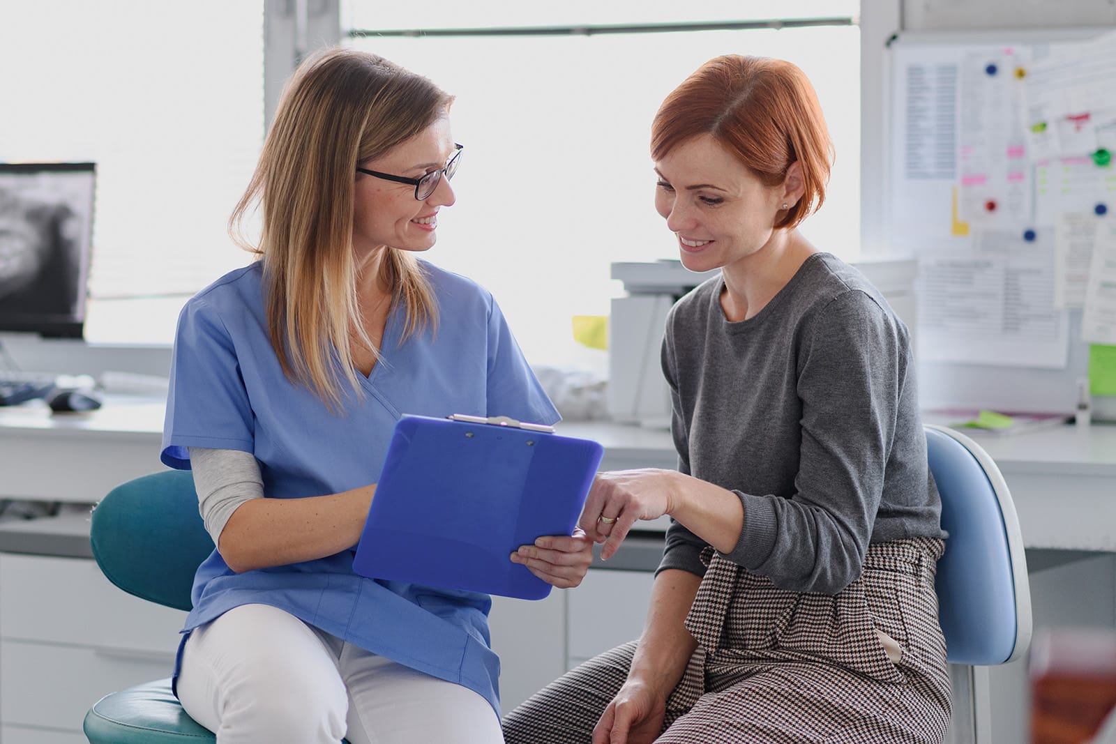 A patient consults with a dentist regarding treatment