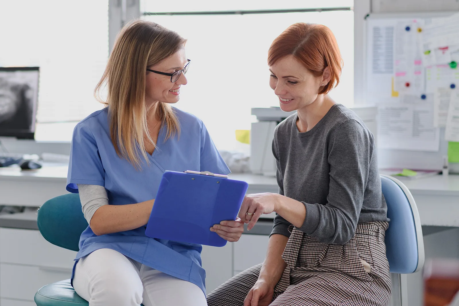 A patient consults with a dentist regarding treatment