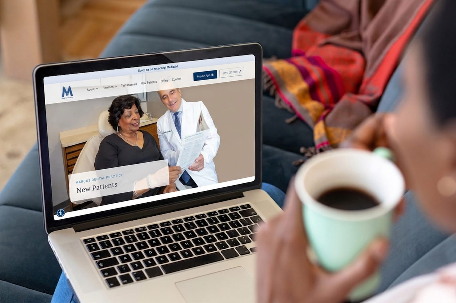 A woman examining a dental website on her laptop